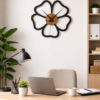 Minimalist SHIU flower outline wall clock displayed as office decor on a white wall above a wooden desk with a laptop.
